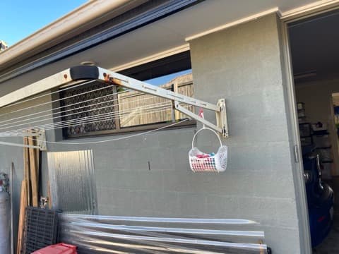 Wall-mounted folding clothesline